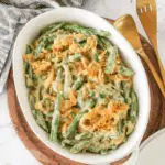 Classic Campbell's Green Bean Casserole topped with crispy fried onions in a white baking dish.