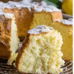 Freshly sliced Italian Limoncello cake with a light, fluffy texture and dusted with powdered sugar.