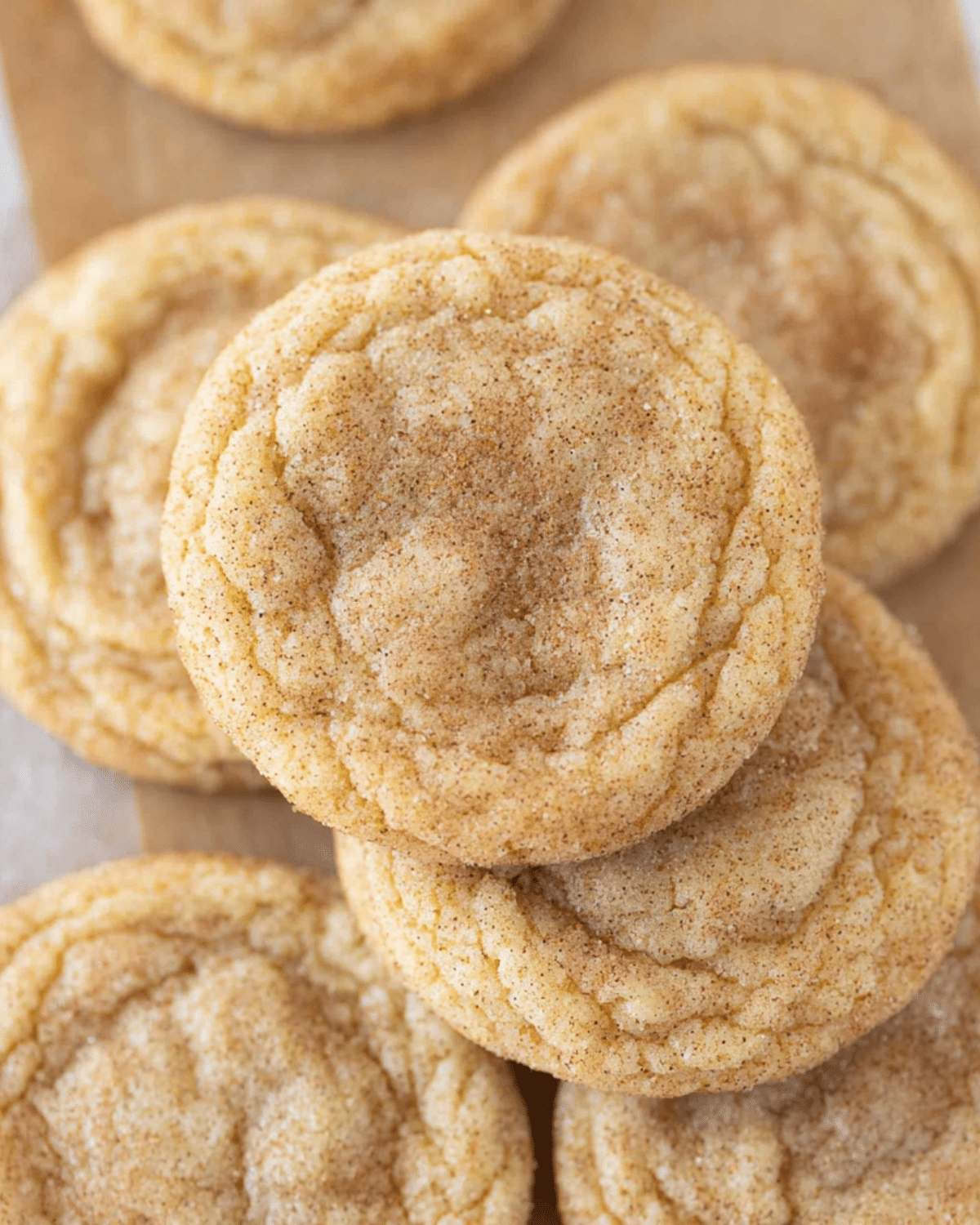 Stack of soft and chewy Pumpkin Pie Spice Cookies coated with cinnamon sugar.