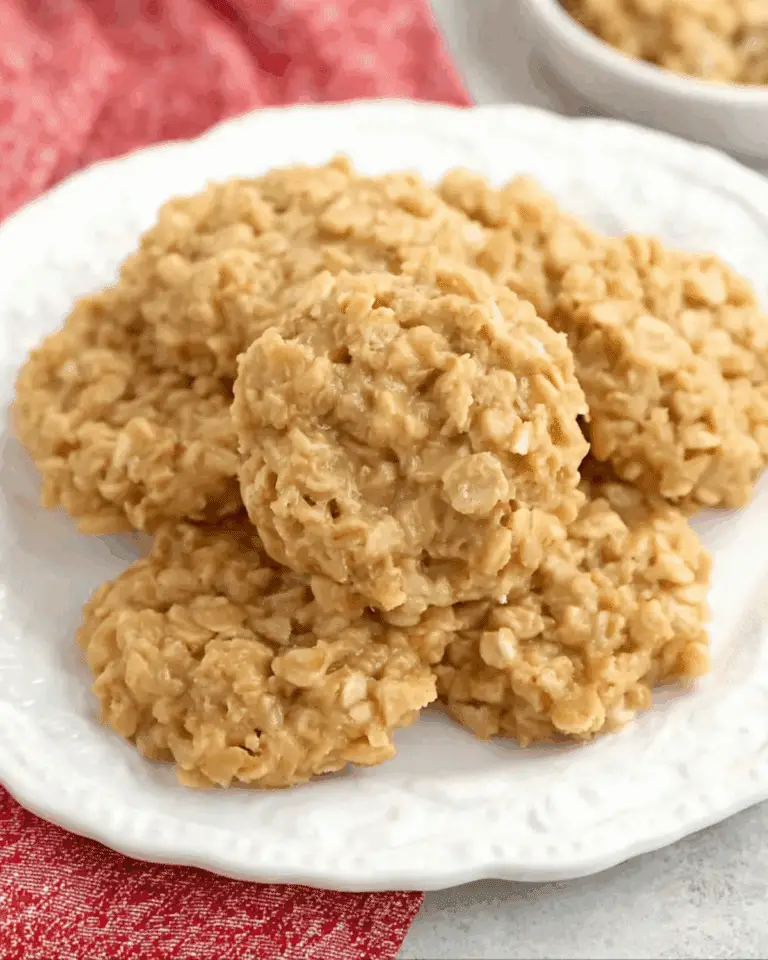 A plate of chewy No Bake Peanut Butter Cookies made with oats and creamy peanut butter, served on a white dish.