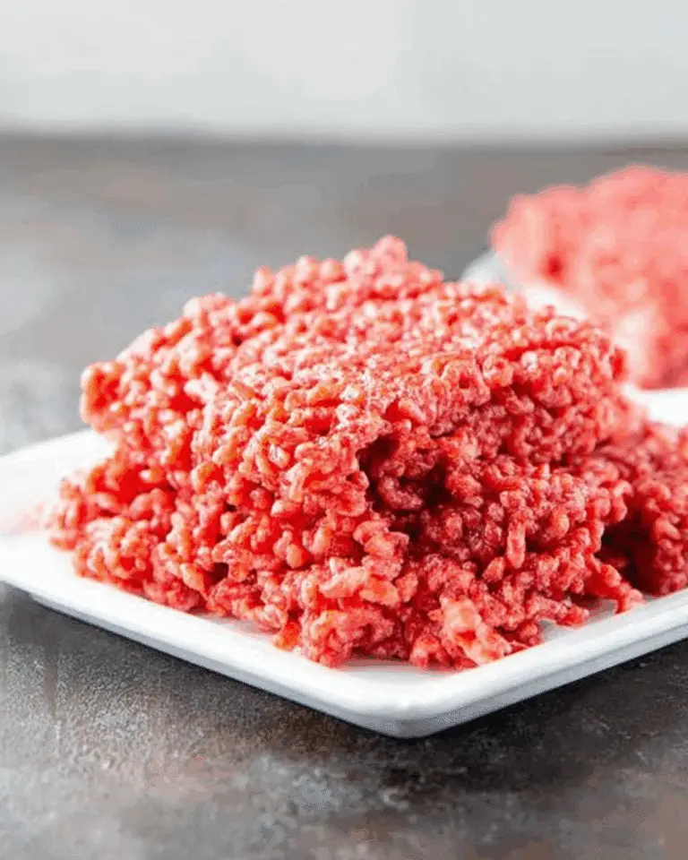 A plate of Raw Meat Rice Krispies, red-colored cereal treats resembling raw ground beef.