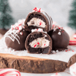 Surprise inside Oreo balls with a creamy peppermint filling, coated in chocolate and topped with crushed candy canes.