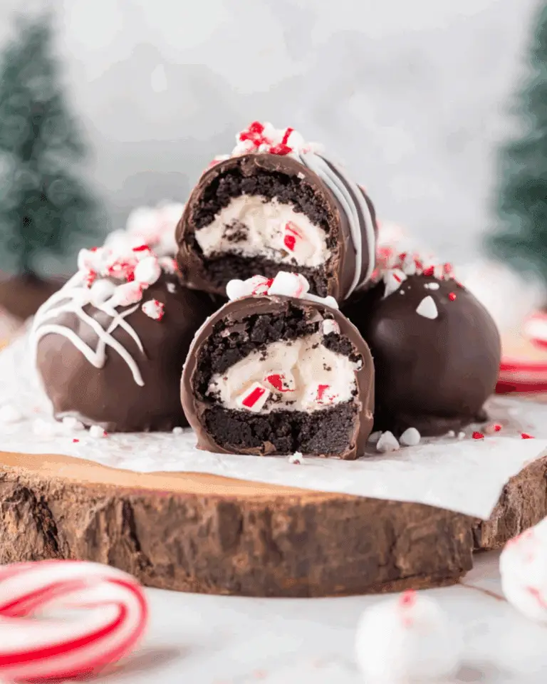 Surprise inside Oreo balls with a creamy peppermint filling, coated in chocolate and topped with crushed candy canes.