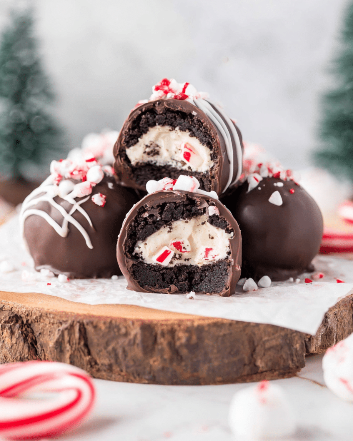 Surprise inside Oreo balls with a creamy peppermint filling, coated in chocolate and topped with crushed candy canes.